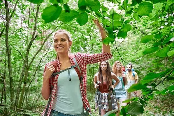 woman and friends hiking through the Smoky Mountains