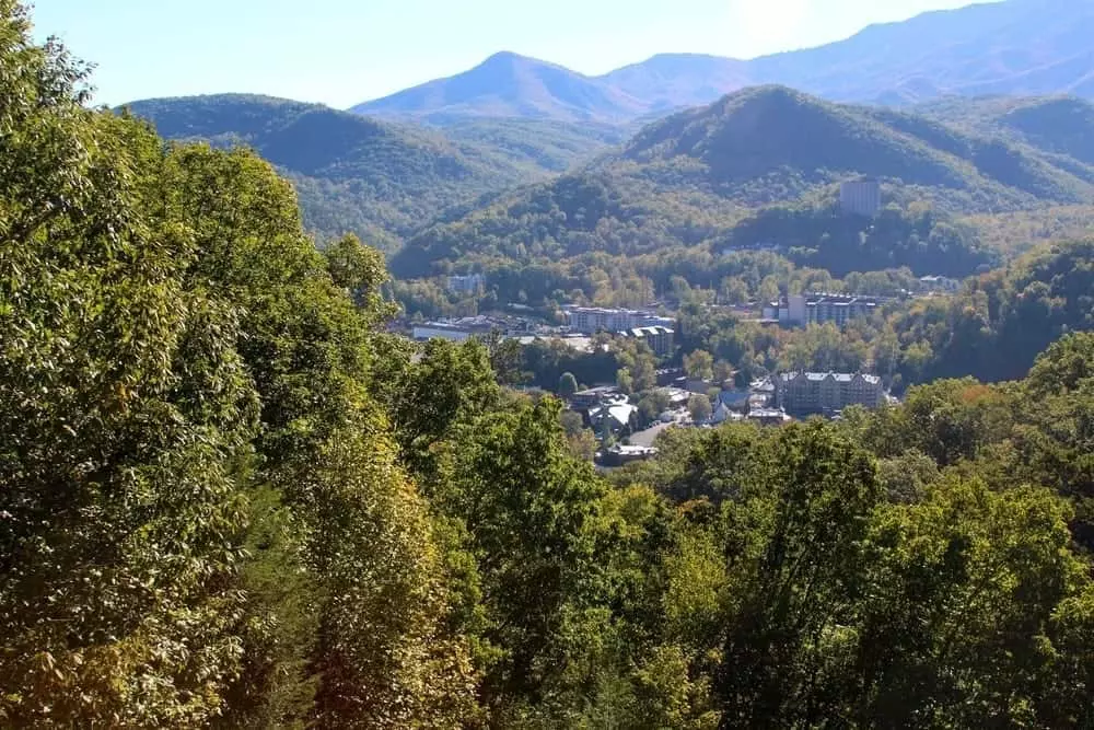 The city of Gatlinburg surrounded by mountains.