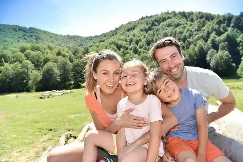 Parents and kids in the mountains.