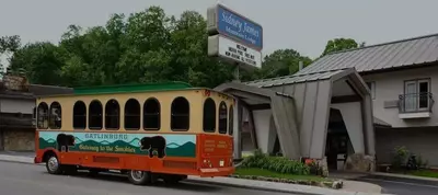 A Gatlinburg trolley in front of Sidney James Mountain Lodge.