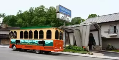 Gatlinburg trolley parked outside Sidney James hotel