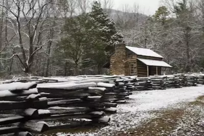 john-oliver-cabin-snow