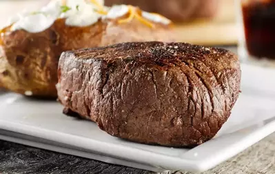 delicious steak with loaded baked potato at Peddler Steakhouse in Gatlinburg TN