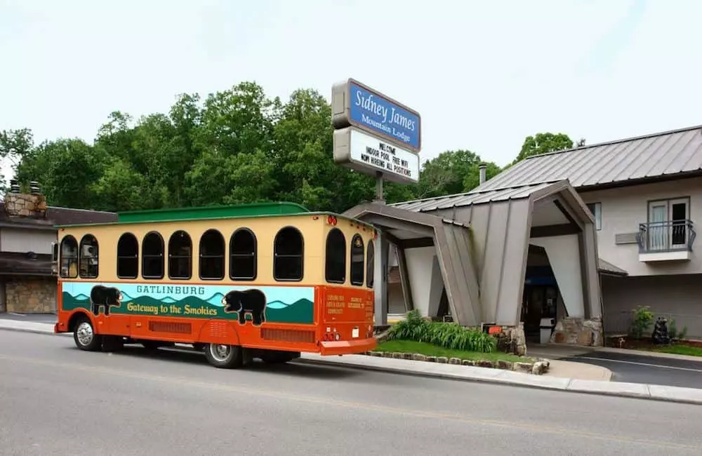 The Gatlinburg Trolley in front of Sidney James Mountain Lodge