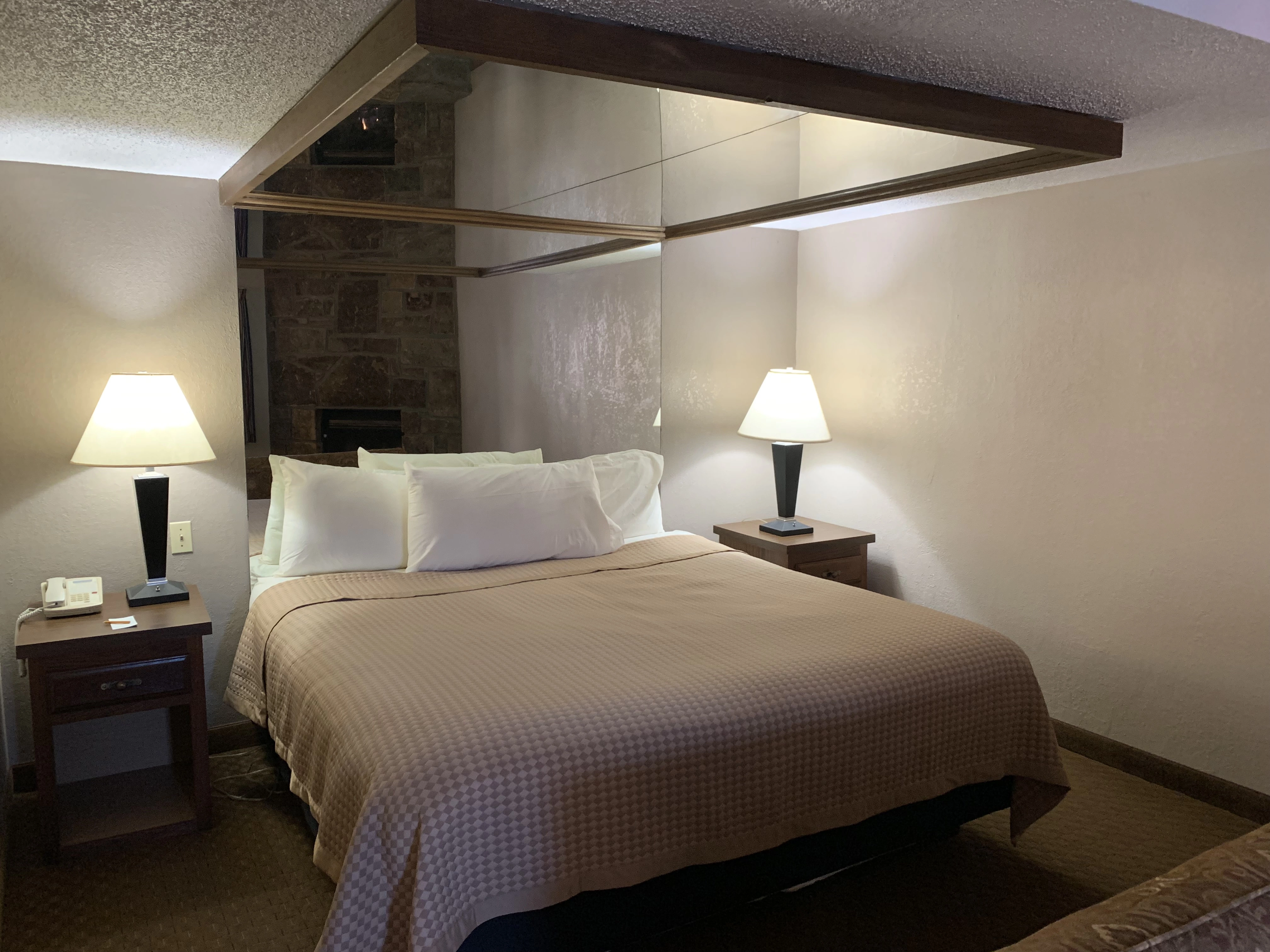 Bed in Non-Creekside Jacuzzi Room