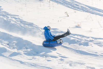 snow tubing down a tubing hill